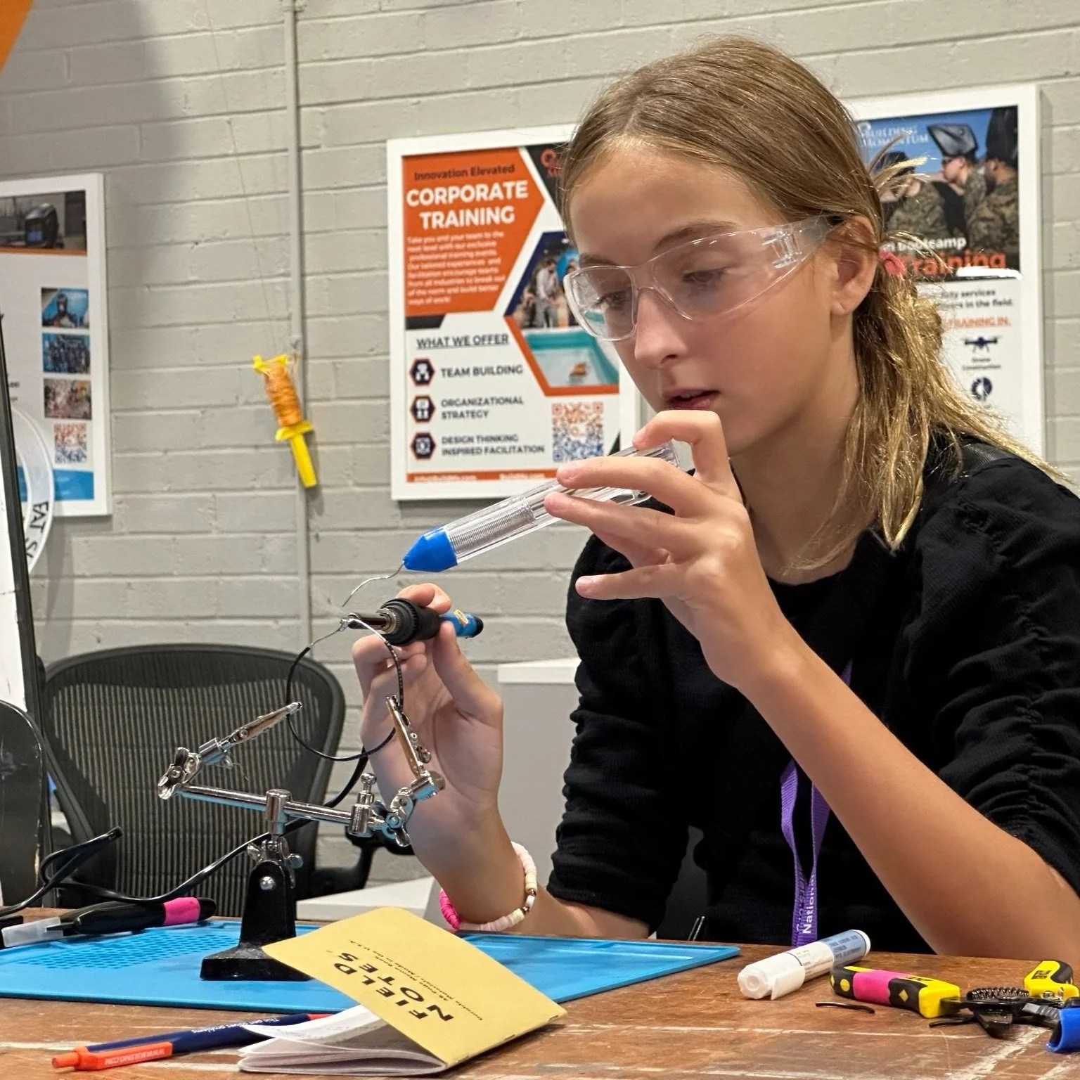 Summer campers building a project
