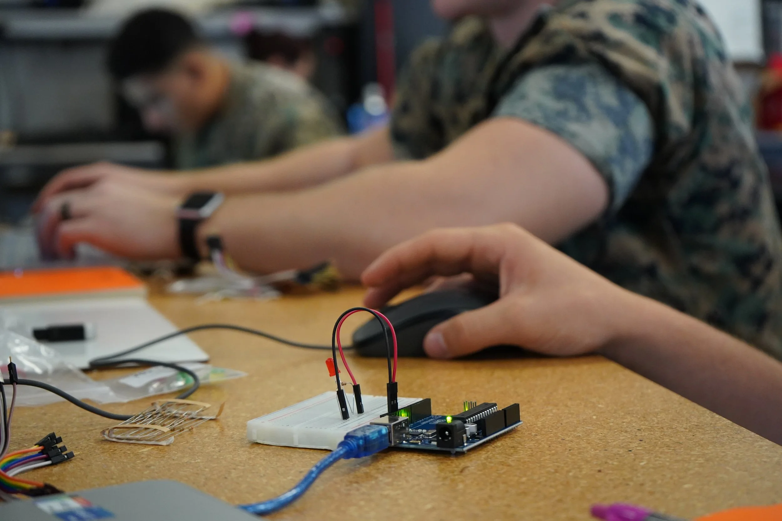 Innovation Academy campers working in the shop