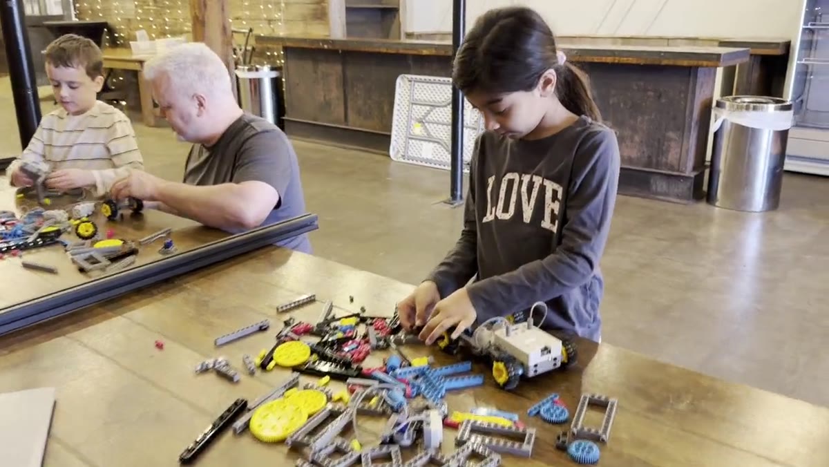 Student building a robotics kit