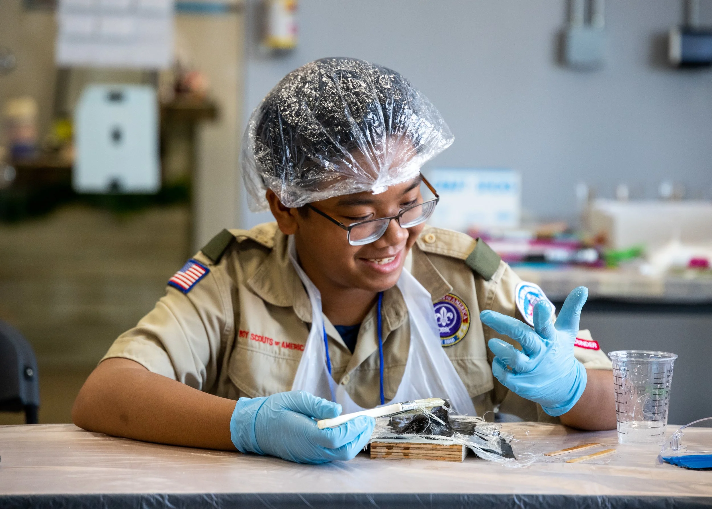 Kids in a scout woodworking session
